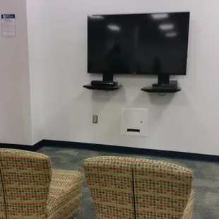 Gaming room with various gaming consoles.