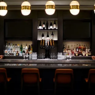 a bar with bottles of alcohol