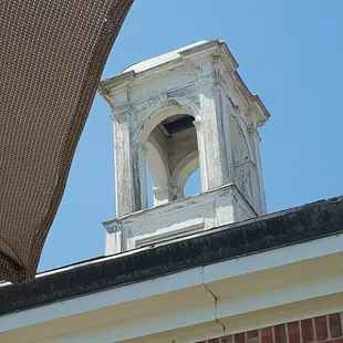 a bell tower on a brick building