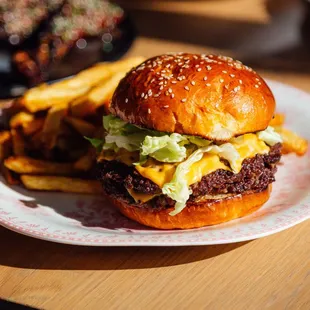 a hamburger and fries on a plate