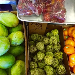 Green mangoes, custard apple (mang cau), tangerines