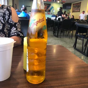 a bottle of cold beer on a table
