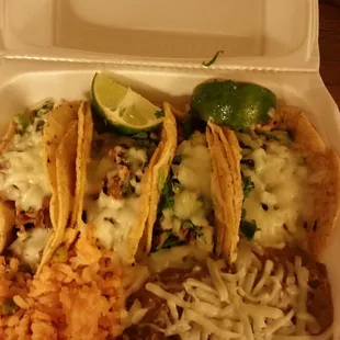 Steak and carnitas tacos with rice &amp; beans