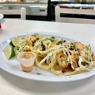 Fish tacos with cabbage and our special house sauce.