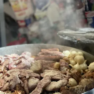 Meats being grilled for tacos