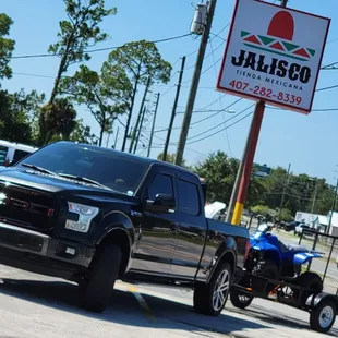 a pickup truck and atv
