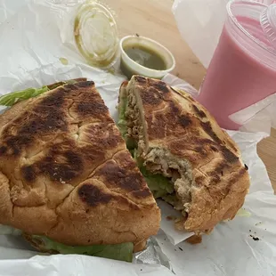 Torta with green sauce with a refreshing strawberry gelatin drink.