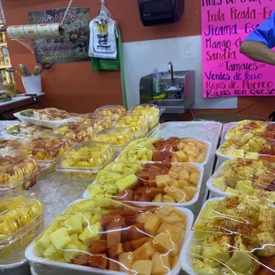 a variety of fruit in plastic containers