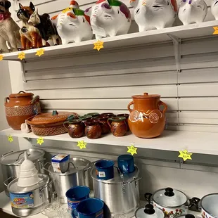 a shelf of pottery