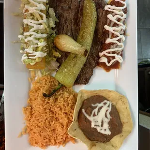 Our delicious tampiqueńa 
Grill steak,chicken enchilada,chicken flauta,grill pepper and onion, rice and beans