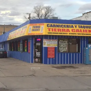 a car parked in front of a restaurant