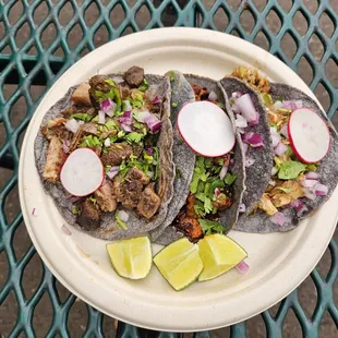 Tacos with lengua, al pastor, and carnitas