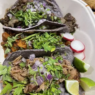 Tacos with carnitas, Al pastor and asada