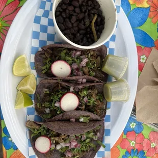 Theee steak tacos and black beans