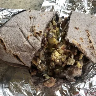 A very good breakfast burrito wrapped in Blue corn.