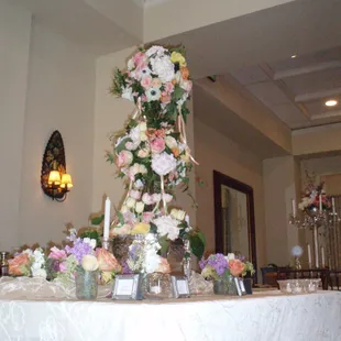Beautiful Floral Topiary - arranged on site for the freshest and highest quality wedding arrangement!