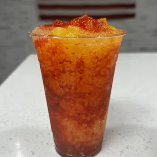 SPICY PINEAPPLE GRANITA
 Finely shave ice mixed with natural homemade pineapple syrup, tajin &amp; chamoy.