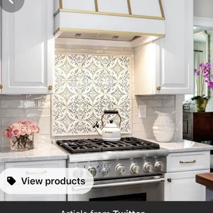 Gas cooktop with beautiful mosaic tile to accent the area.