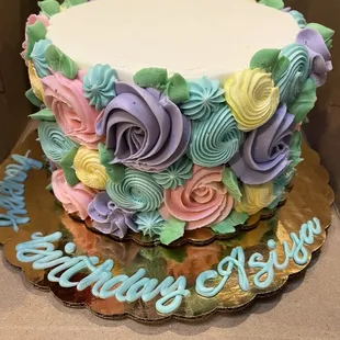 White cake with pastel flower, buttercream icing 10/10