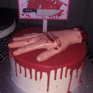 Marble cake with a bloody design!!!  Hand and sign created by me but the cake is totally them!!