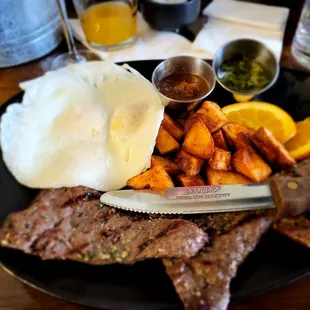 Skirt steak served with your style of eggs, roasted red potatoes, and a citrus twist