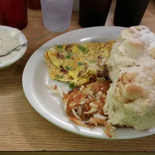 Audrey Hepburn omelet with biscuits and gravy.