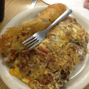 The classic Tiffany&apos;s omelette will fill your entire plate up. It has ham, bacon, sausage, cheddar and jack cheese.