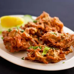 Onion Bhaji...Onion, potato, and spinach fritters fried in a gram flour batter.