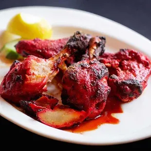 Tandoori Chicken...Bone on chicken marinated in tandoori spice mix and cooked in the tandoor. Includes Basmati rice.