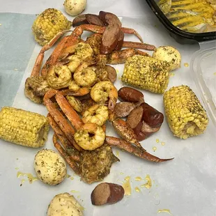 1 lb Love Butta Baked Snow Crab Clusters, 1/2 lb Shrimp, 1/2 lb Sausage, Potatoes, 1 Corn, 1 Egg Turkey Sausage