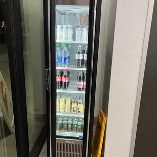a soda cooler with a coke in it