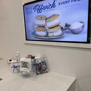 a counter with a tv in the background