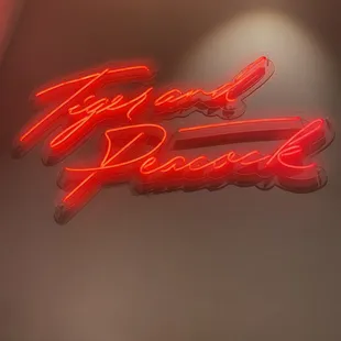 a neon sign on a wall