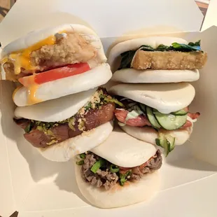 Each one of their 5 types of bao: 5 cup sauce tofu, breaded fried cod, chashu chicken cutlet, pork belly and Korean beef