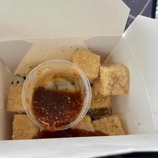 a box of tofu and sauce