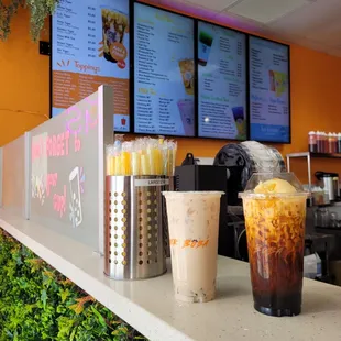 two cold drinks on a counter