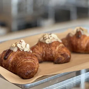 three croissants on a tray