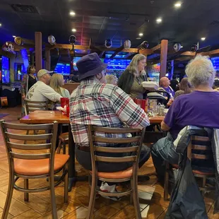 a group of people sitting at a table
