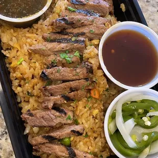 Garlic Fried Rice with add on: char grilled steak, make it spicy (pickle onions &amp; jalapeños), and (2) additional sauces!
