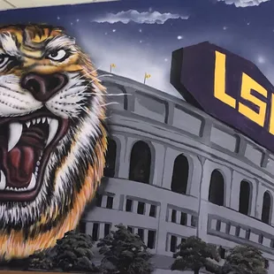 a mural of a tiger in front of a lsu stadium