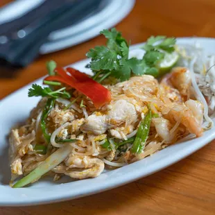 a plate of food on a wooden table