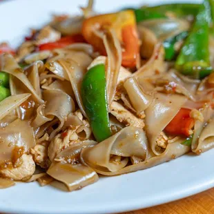 a plate of noodles and vegetables