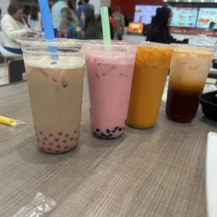 Phenomenal Dragonfruit milk tea, Thai Milk Tea, and Classic Milk Tea with strawberry boba.