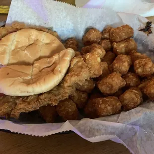 Love this place!  Huge tenderloin, crispy tots, hard working staff. Great neighborhood bar.
