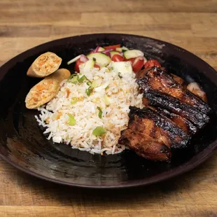 a plate of meat and rice