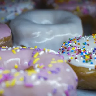 a variety of donuts with sprinkles