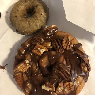 Blueberry cake donut and a cinnamon roll (with chocolate and pecans)