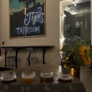 a row of beer glasses on a table