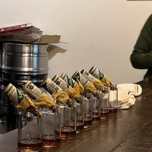 a row of glasses of whiskey
