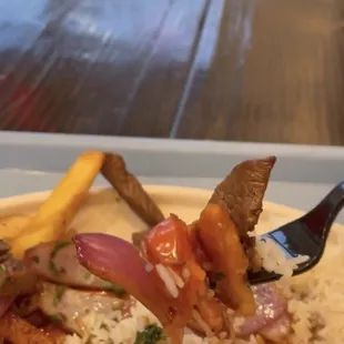 a plate of food with a fork in it